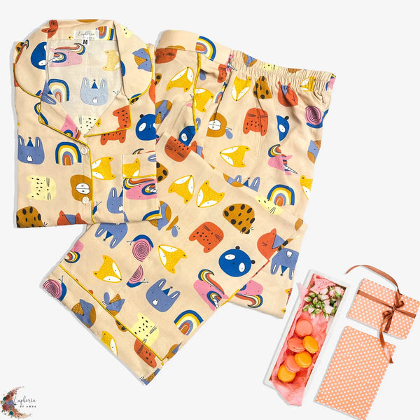 Playful Print – “Rainbows, cats, and  coziness galore—your new happy-place  pajamas