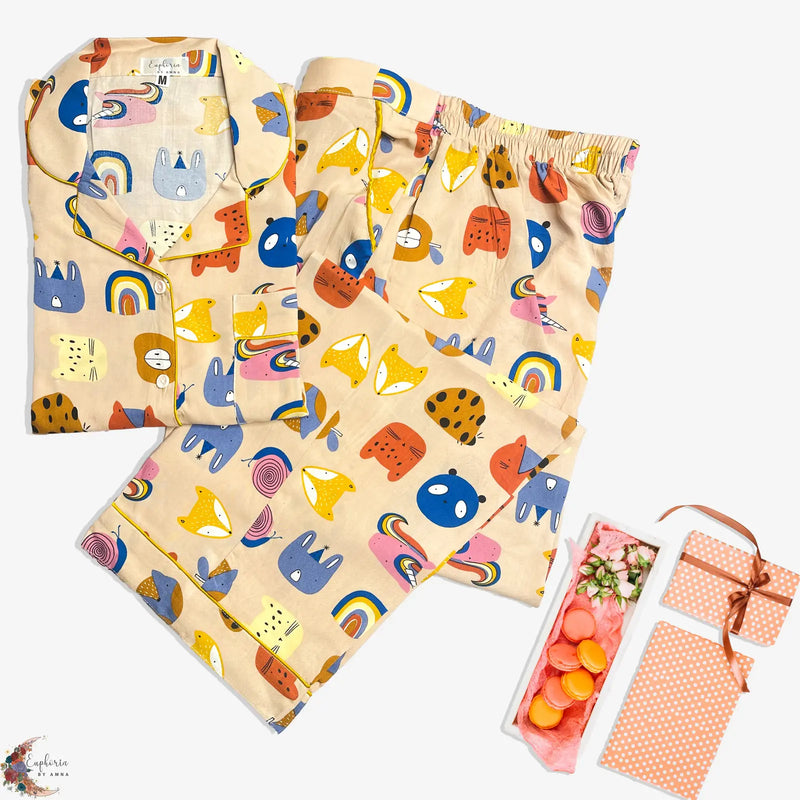 Playful Print – “Rainbows, cats, and  coziness galore—your new happy-place  pajamas